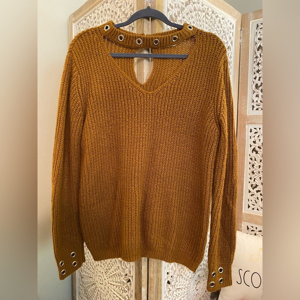 Mustard sweater.